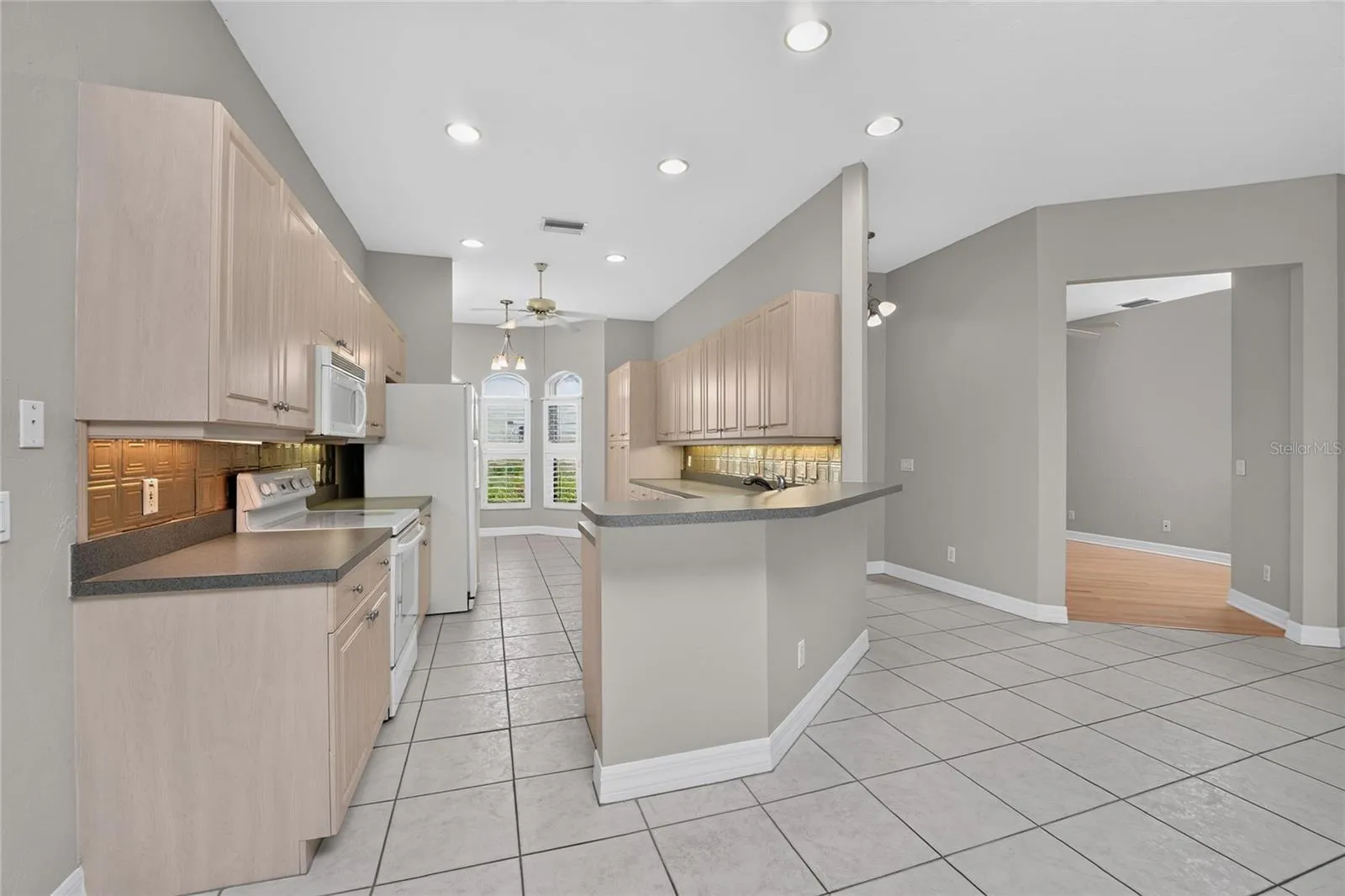 Kitchen, foyer, front entry and den.
