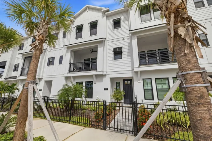 Front exterior with private fenced courtyard