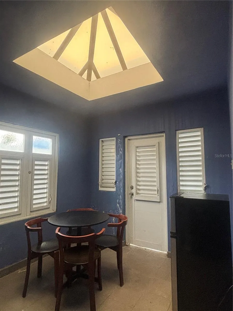 Breakfast Nook is a few steps up from the Kitchen and door to the side entryway.