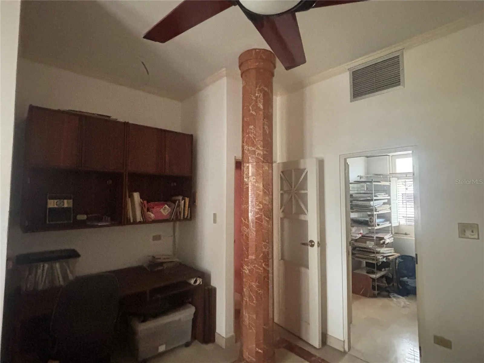 2nd Bedroom has entrance to the upper gallery, built-in closet area (used as office) and entry to walk-in closet.