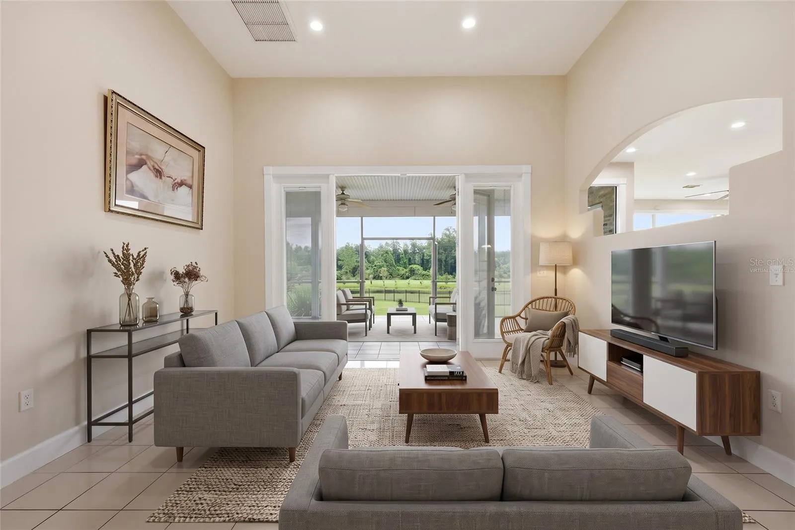 virtually staged Living room with french doors to covered patio