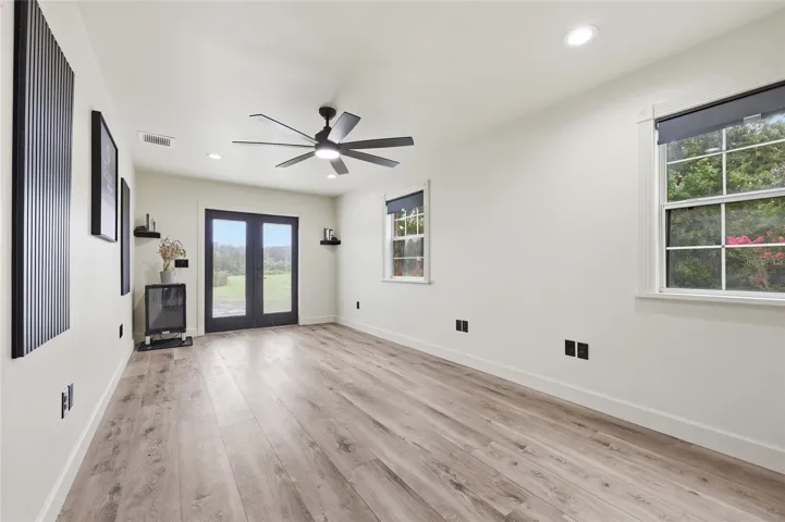 Garage Office, New Flooring, window and lights.