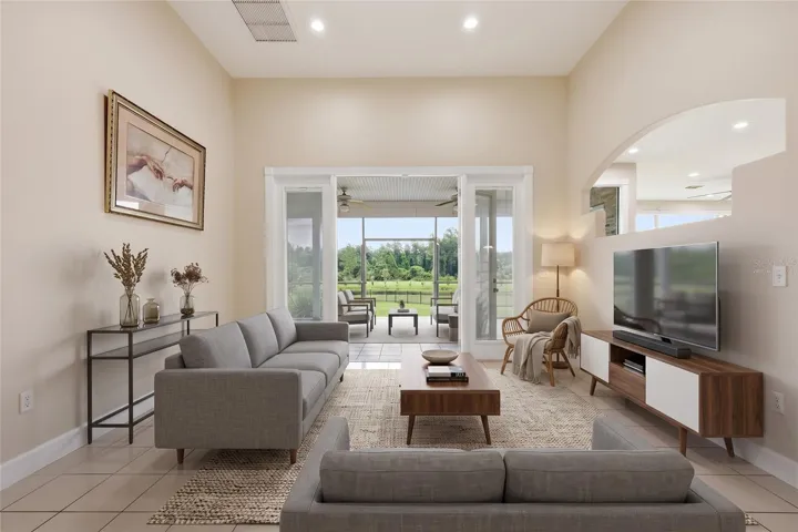 virtually staged Living room with french doors to covered patio