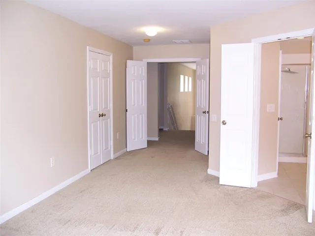 Bright Primary Bedroom, Carpeted.