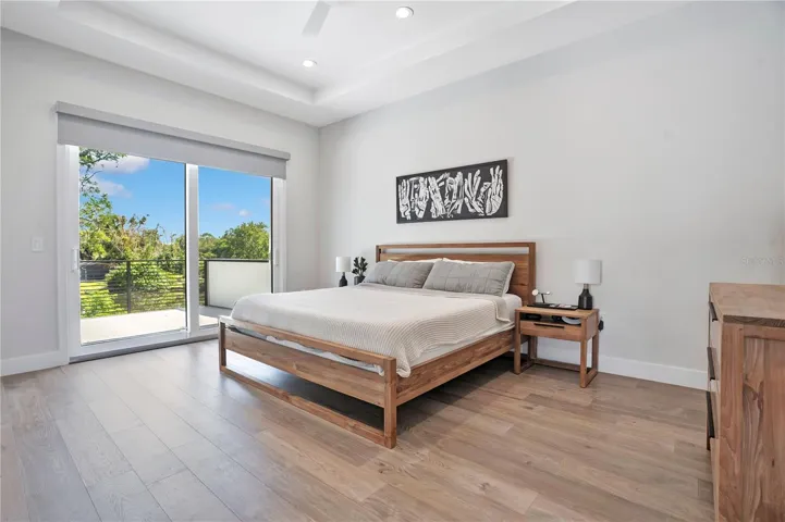 Primary bedroom with patio door view.