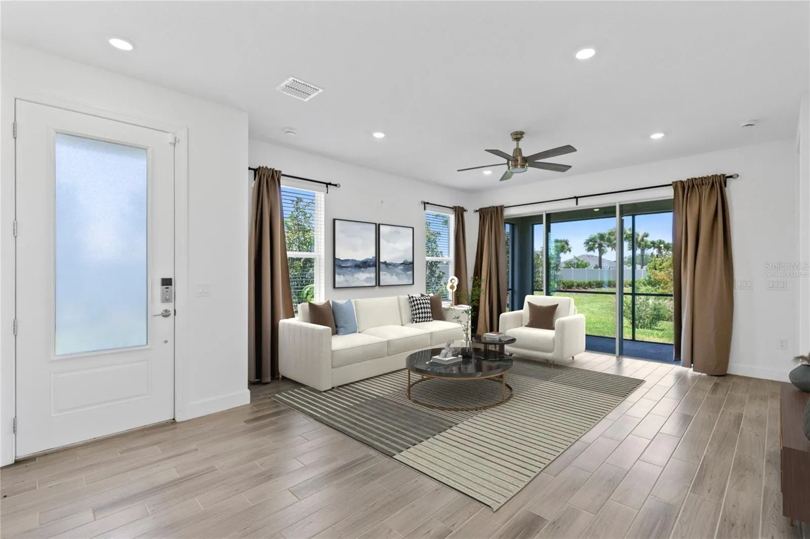 Virtually Staged Image. Entry, Living Room.