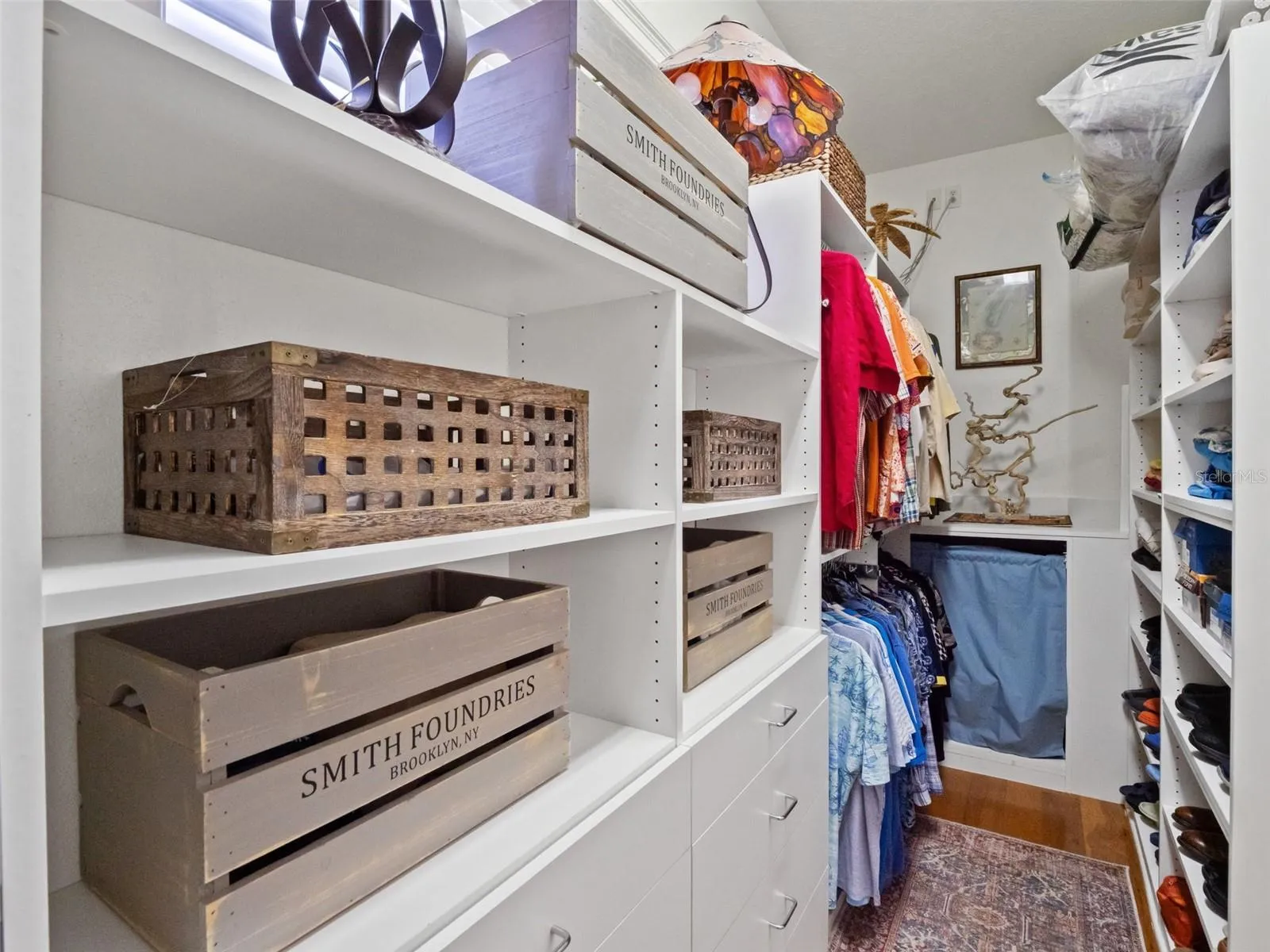 One of two large custom walk-in closets