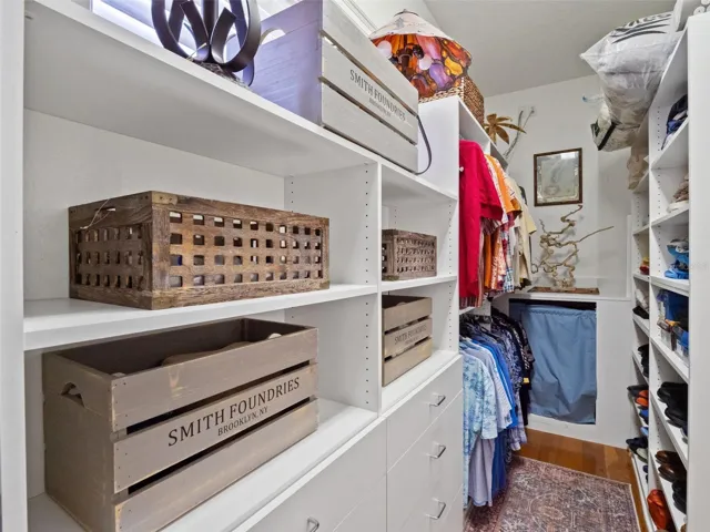 One of two large custom walk-in closets