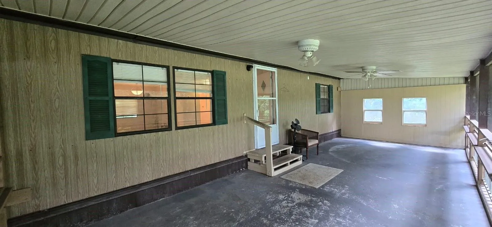 Screened-in porch on front of home