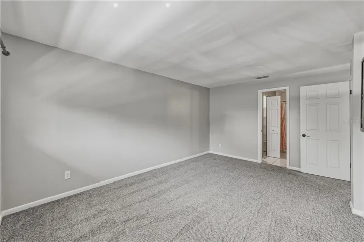 Primary bedroom looking towards bath entrance.