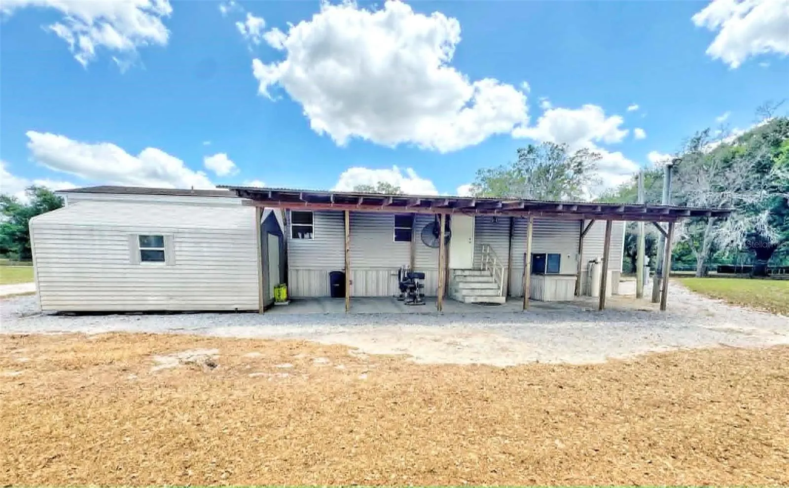 Back covered porch and storage shed