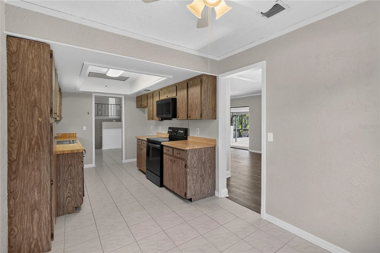 View 2 - Kitchen from angle of eat-in dinette area.  Doorway shown to Dining Room