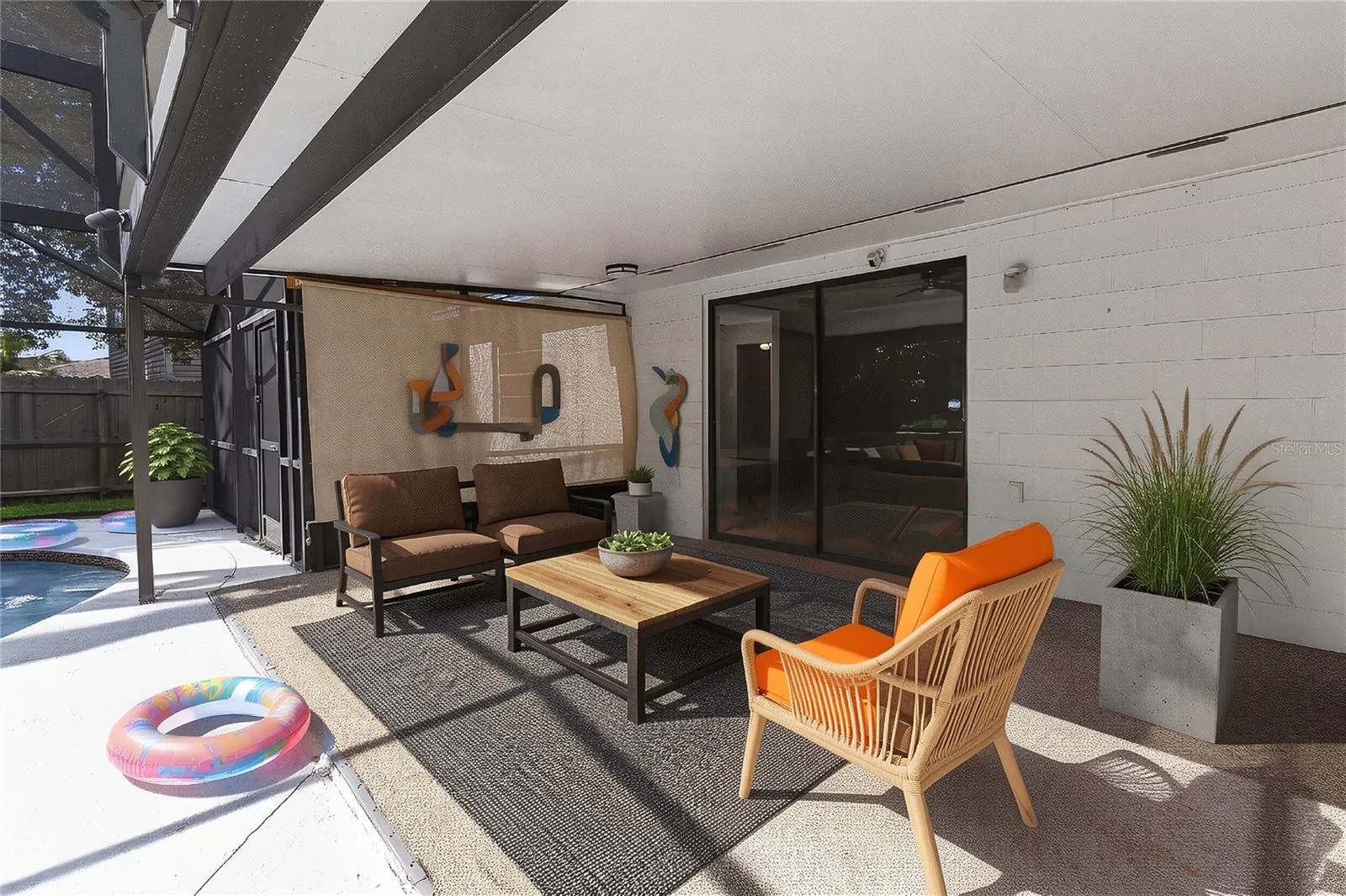 Shaded living space in the outdoor back patio.  Enjoy additional living spacing connecting the indoor and outdoors. (virtual furnishings)