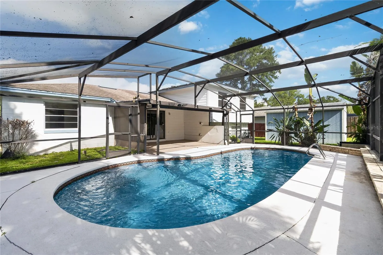 Screened Pool Lanai — Keeps bugs, leaves, and wildlife out while allowing breezes in. Connecting your indoor and outdoor space. Enjoy the outdoors while reducing the things Floridians dislike most — bugs & harsh sunlight.