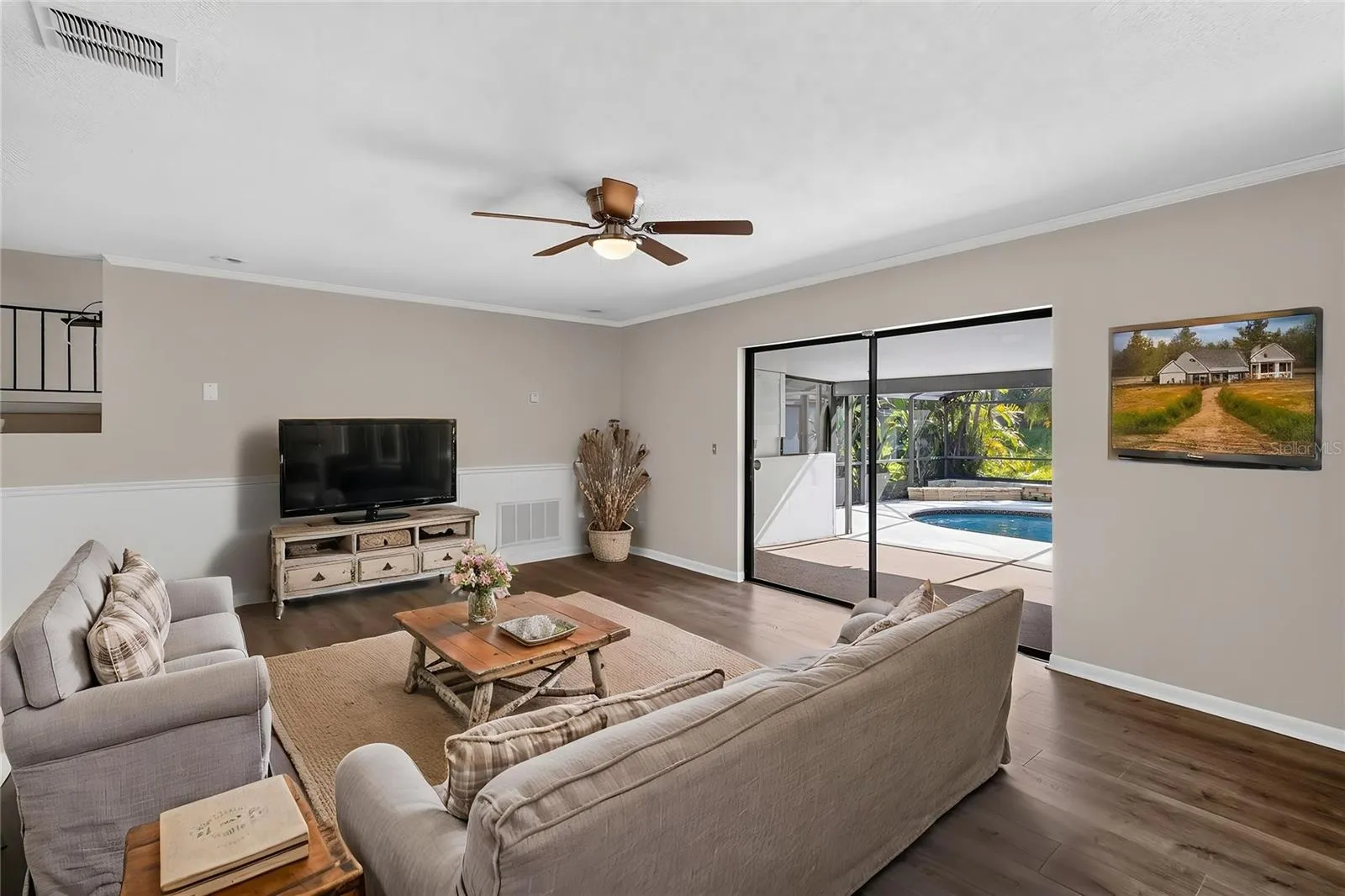 Living Room (14x20) is open and bright with pool views (virtual furnishings)