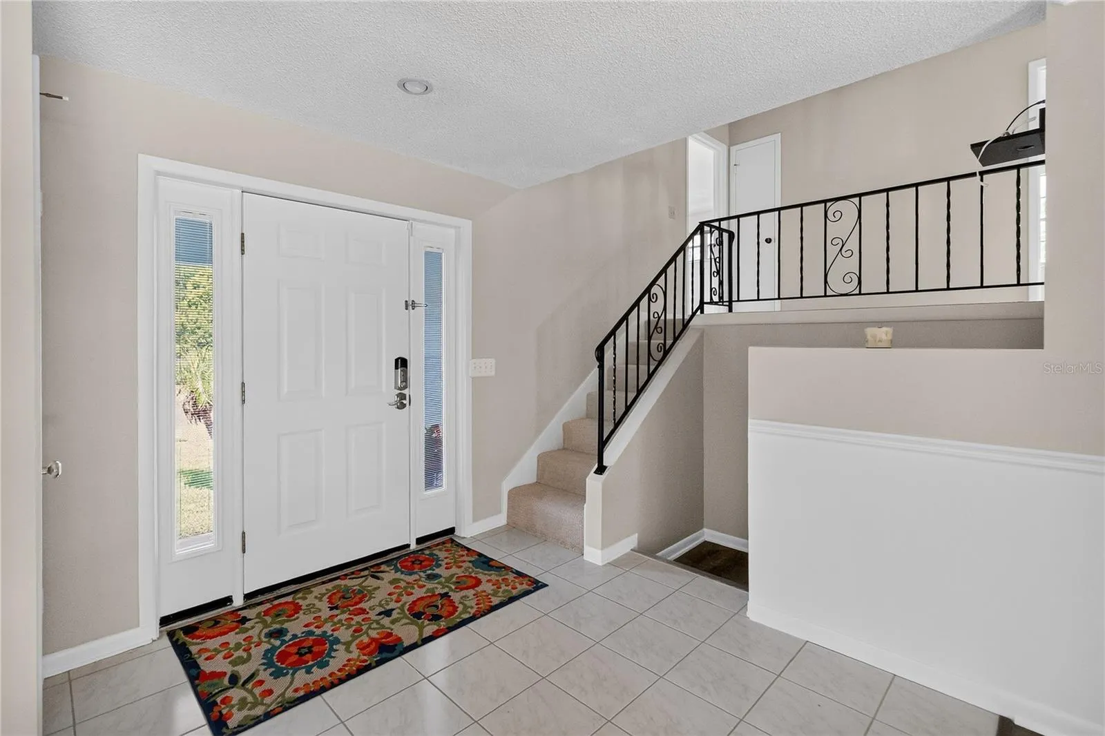 Front Door entry to foyer - main floor with eat-in kitchen, liivng room, dining room.  Bright and light.  Upstairs to 4 bedrooms.  Downstairs to workshop garage, 1/2 bath, laundry room and 5th Bedroom OR Bonus Room or potential Mother-in-Law suite.