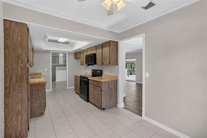 View 2 - Kitchen from angle of eat-in dinette area.  Doorway shown to Dining Room