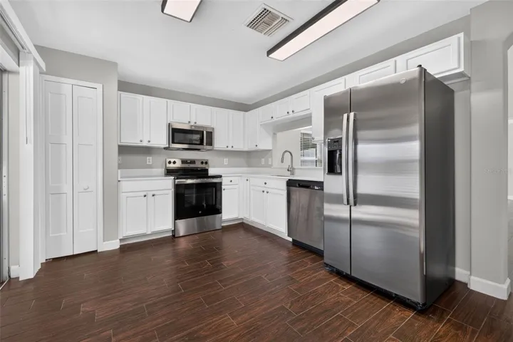 White Cabinetry Chefs Kitchen with Pantry