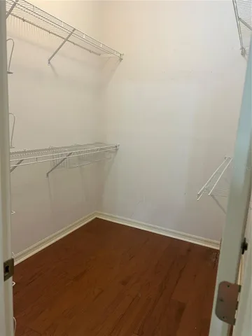 Primary bedroom walk in closet