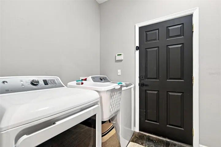 Garage entrance and Laundry Room