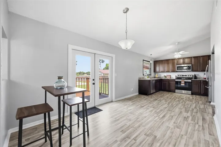 Kitchen w/nook area. French doors lead out to the backyard deck.