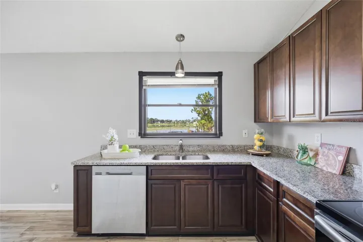 Kitchen w/view to the back yard and lake