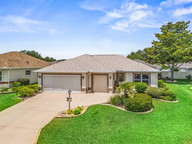 aerial view, 2 car garage and golf cart garage