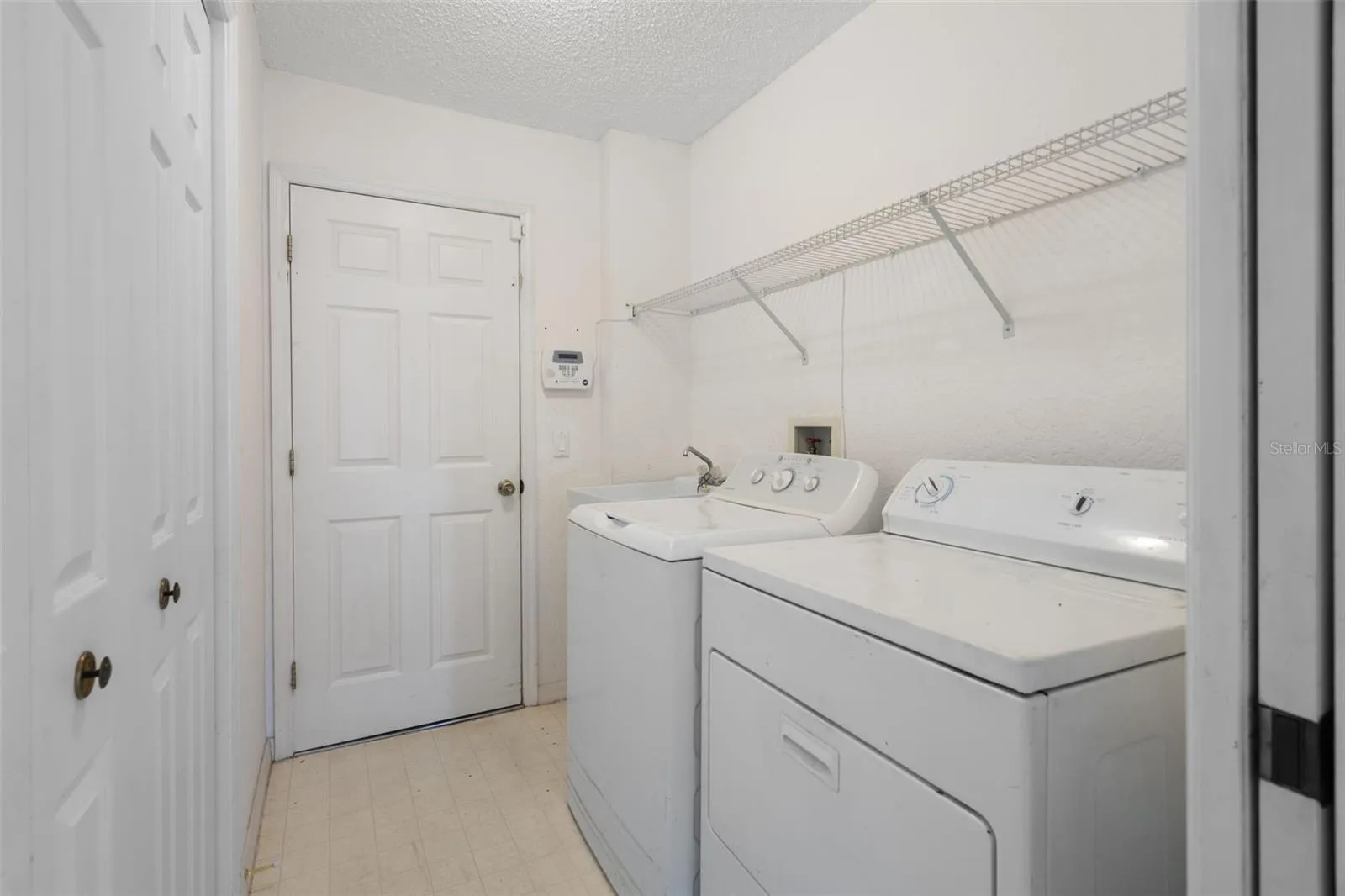 Laundry with storage closet