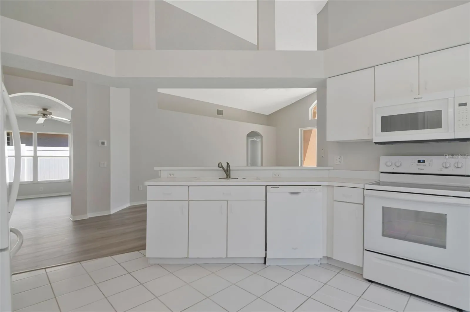 Kitchen Area Across from Formal Dining Room w/ Breakfast Bar