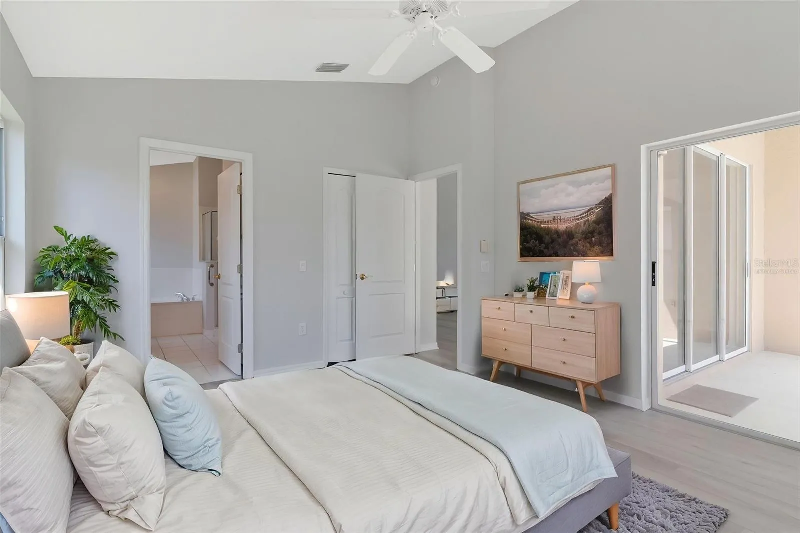 Main Bedroom with room & bathroom entry doorways virtually staged