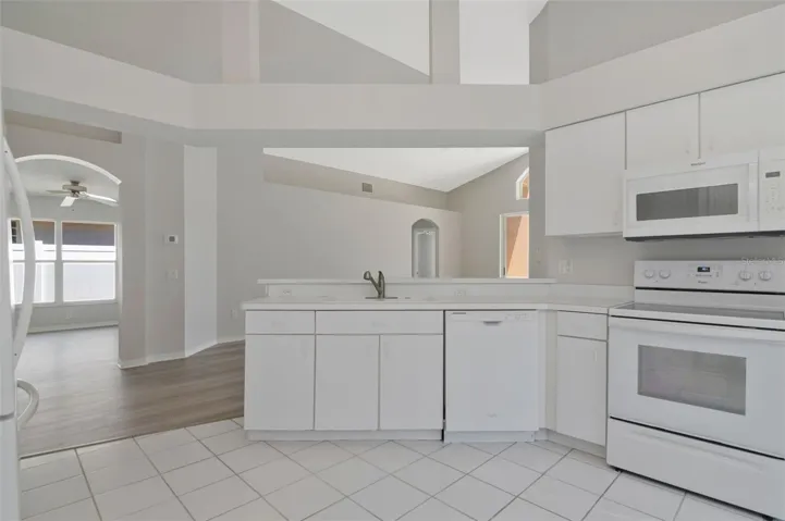 Kitchen Area Across from Formal Dining Room w/ Breakfast Bar