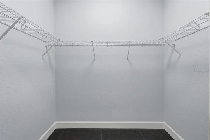walk-in closet in primary bedroom