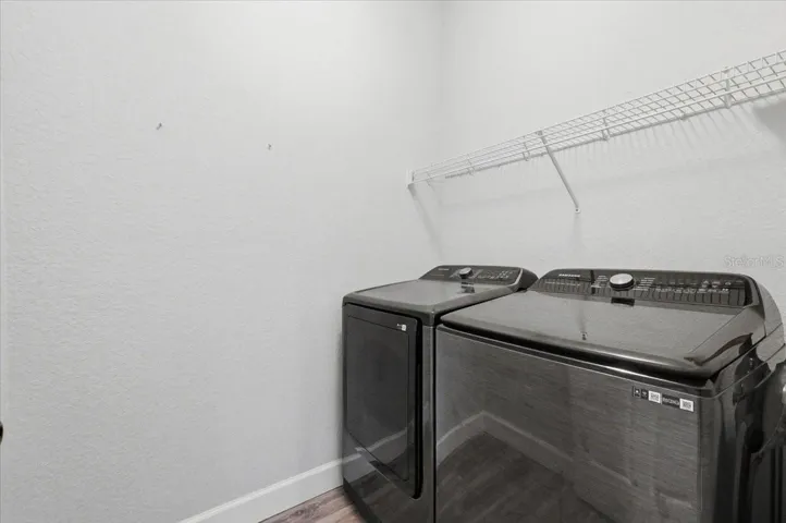 Laundry room between kitchen & garage
