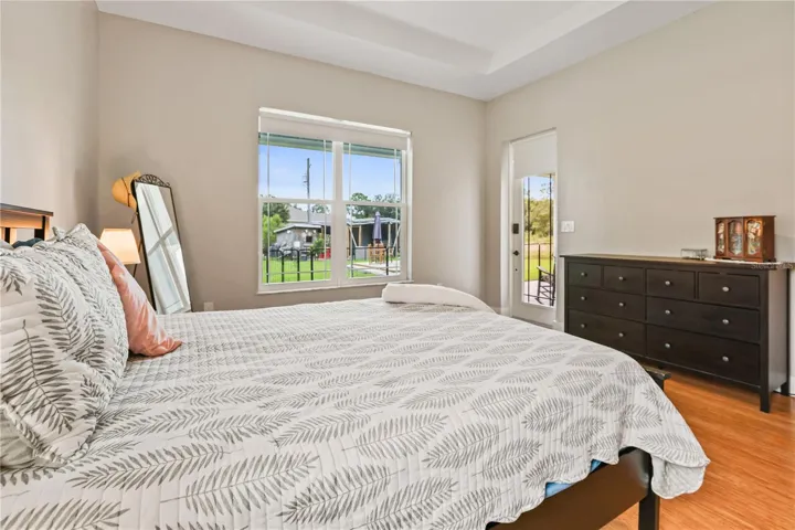 Primary Bedroom w/ door to back porch
