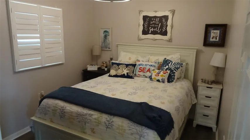 Bedroom #2. Plantation shutters on all windows.