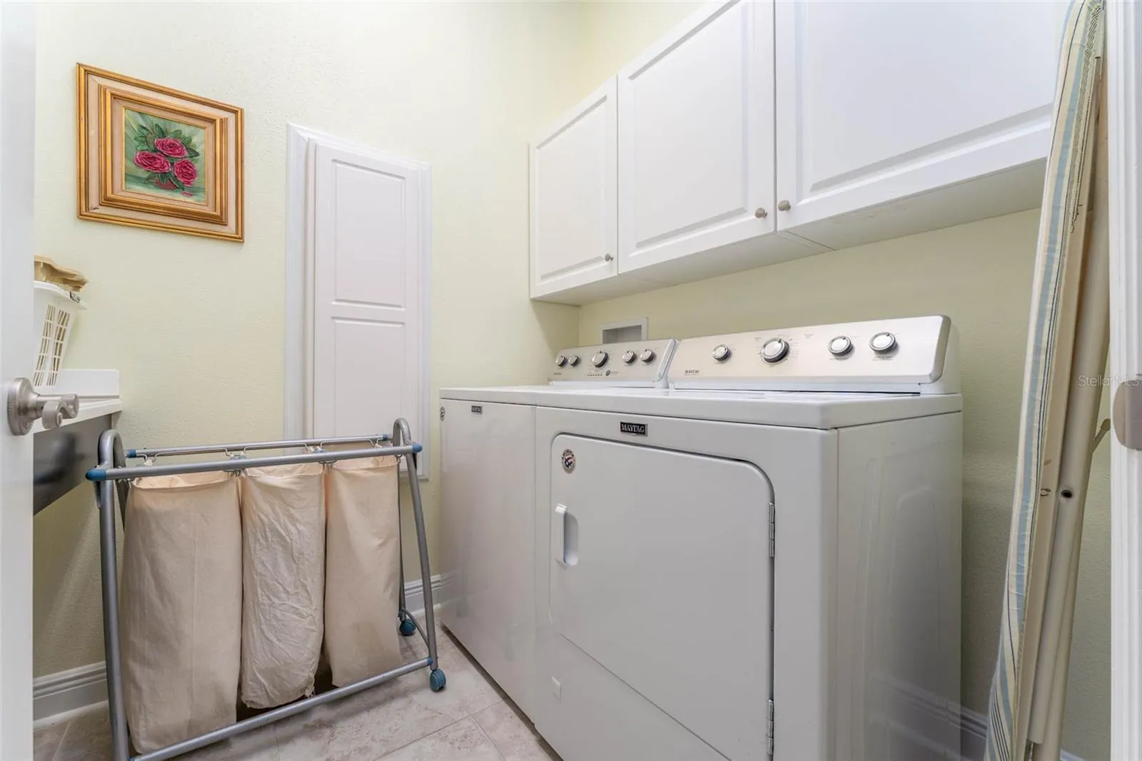 Laundry Room with Maytag Washer &amp; Dryer, Built in Cabinetry, Laundry Sink &amp; Folding Table