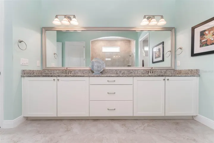 Spa like Primary Bath with Large Walk in Shower, Vanity with Dual Sinks, Granite Tops &amp; Plentiful Cabinetry with Drawers