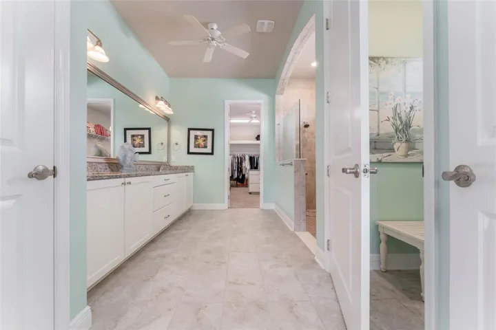 Spa like Primary Bath with Large Walk in Shower, Vanity with Dual Sinks, Granite Tops &amp; Plentiful Cabinetry with Drawers