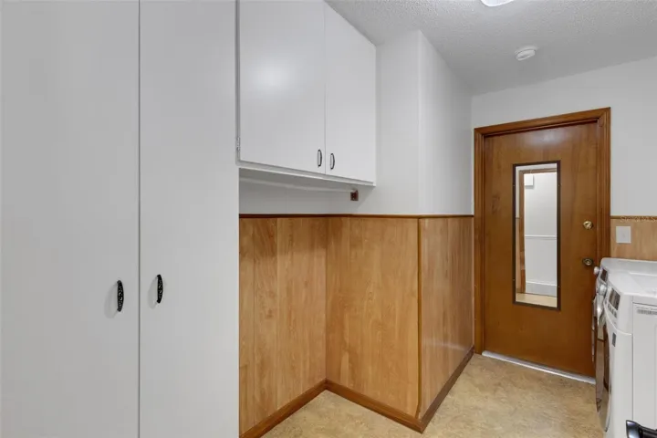 There is plenty of storage for your walk in laundry room. Even has space for another fridge or freezer.