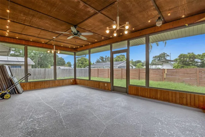 spacious rescreened lanai with a fresh coat of paint