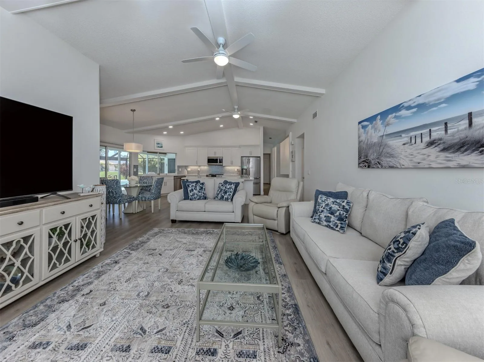 This warm and inviting space is the perfect place to enjoy a movie after a day at the beach on on the golf course