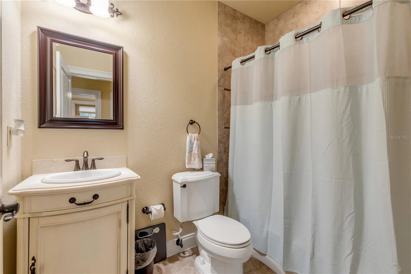 Full bathroom downstairs for guest bedrooms
