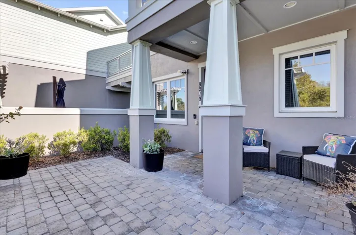 Private covered patio with paver flooring — the perfect low-maintenance outdoor retreat.