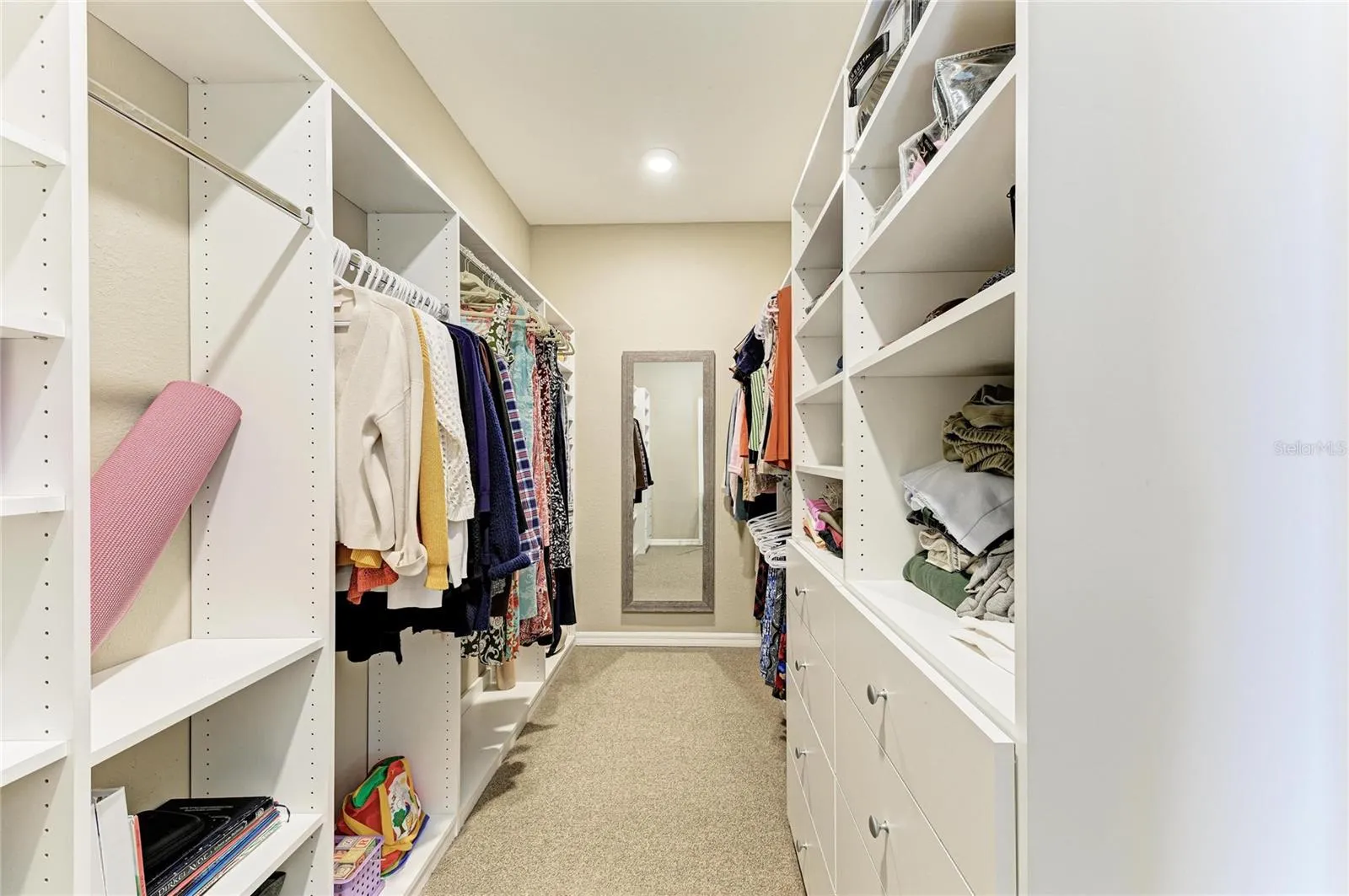 Primary closet with custom built ins