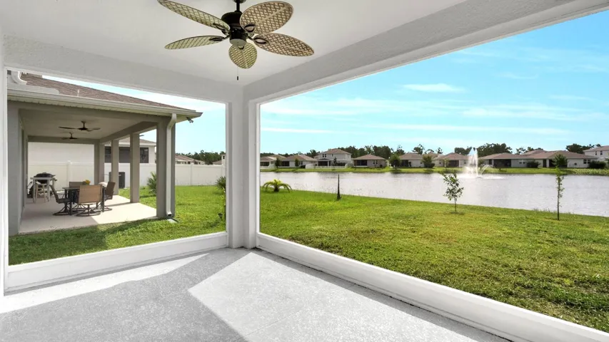 screened in covered lanai with pond views