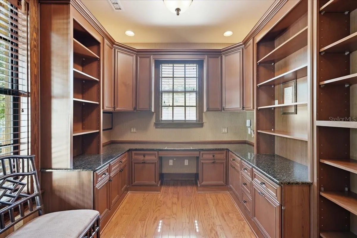 Office with Built-in Shelves and French Doors