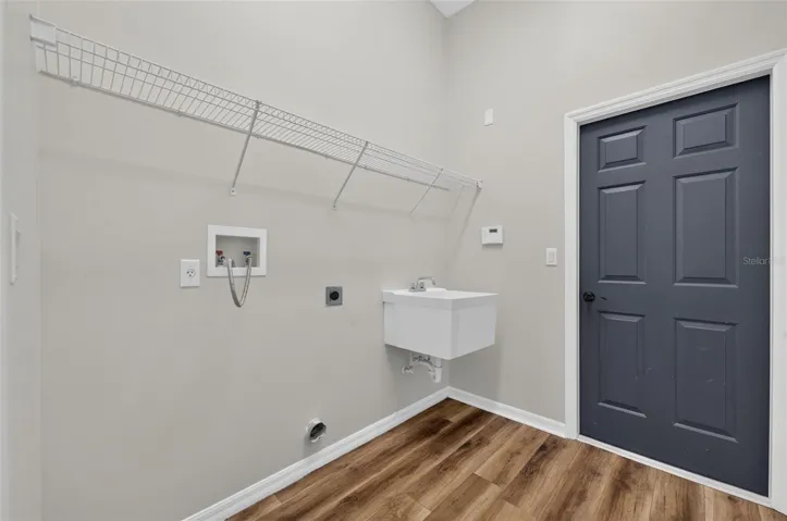 Laundry room with exit to garage