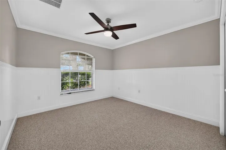Spacious 2nd bedroom with Wainscoting surounding the room