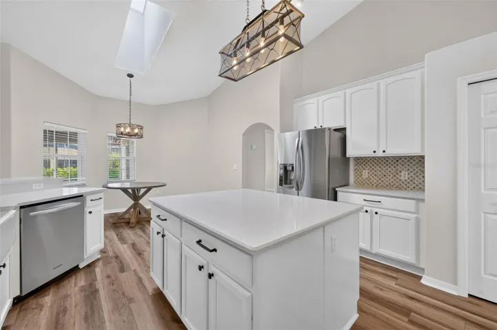 White cabinets and a stylish backsplash make this space feel modern and bright!