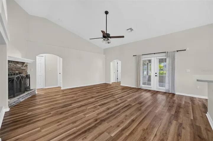 Large open living space with high ceilings and a gorgeous stone fireplace!!